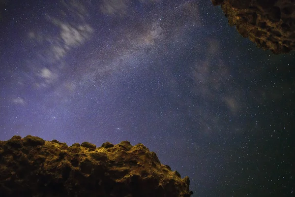 Milky Way view from the ancient Roman ruins, with walls constructed with the typical structure of a honeycomb.