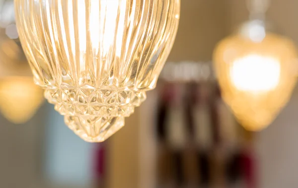 Detail of  hanging light covers of crystal in a bathroom.  Fashionable lighting for the home.