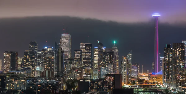 Cloud\'s edge cuts through hot humid night time air in Toronto, Canada.