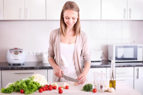 Young Woman Cooking in the kitchen.