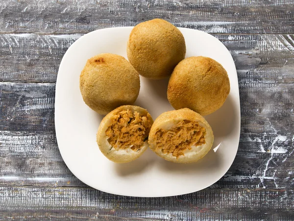 Brazilian snack. chicken dumpling with curd on white background.