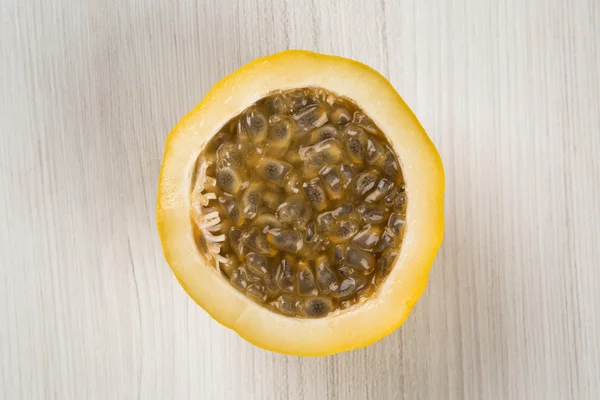 Close up of some passion fruits over a white background.