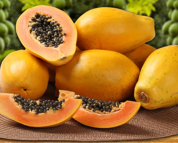 Fresh cut juicy tropical papaya mamao fruit with seeds at Brazil