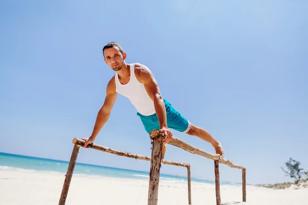 Fitness man on the beach