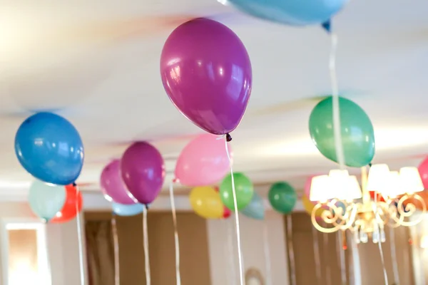 Colorful balloons floating on the ceiling of a party in vintage childhood memory color style for festival like birthday or christmas celebration party
