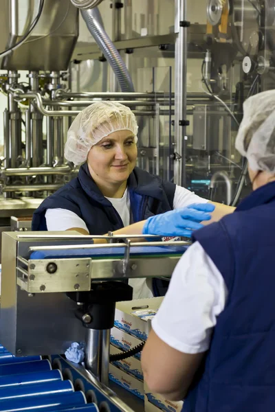 Worker puts the finished product in boxes