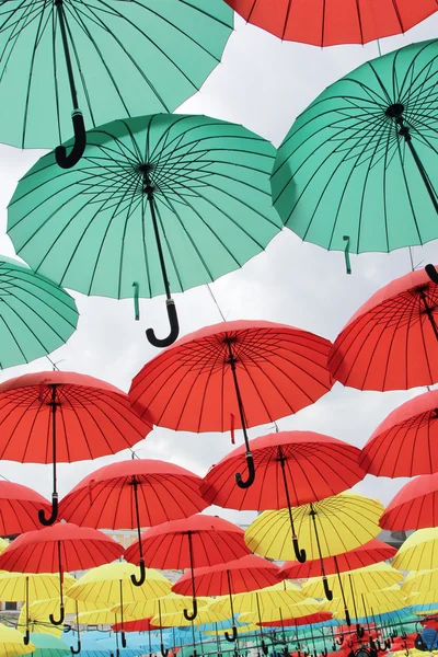 A lot of multicolored umbrellas. Color umbrellas urban decoration