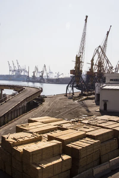 Odessa, Ukraine - July 26, 2015: Cargo cranes on rails and cargo