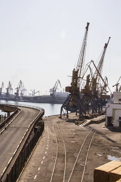 Odessa, Ukraine - July 26, 2015: Cargo cranes on rails and cargo