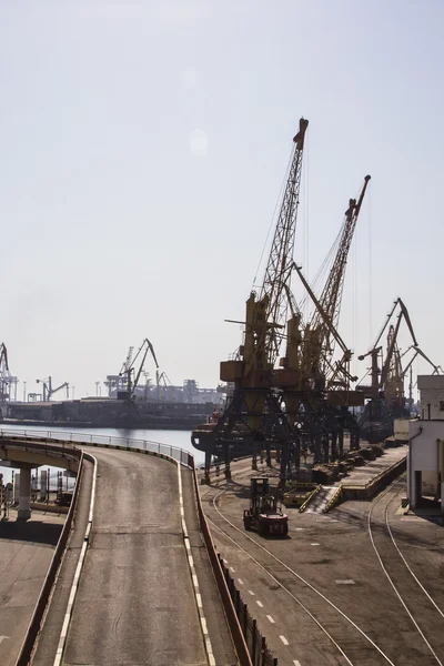 Odessa, Ukraine - July 26, 2015: Cargo cranes on rails and cargo