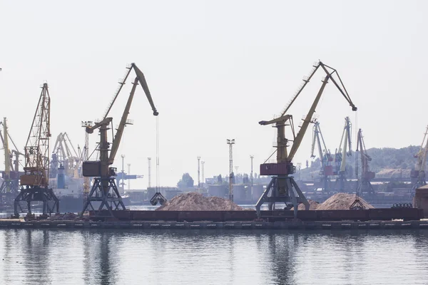 Odessa, Ukraine - July 26, 2015: Cargo cranes on rails and cargo