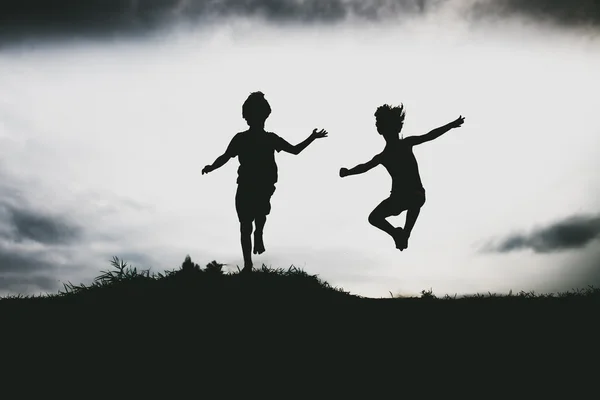 Kids jumping from a cliff