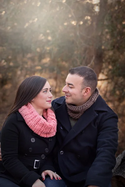 Outdoor portrait of a couple wearing dark coats