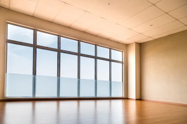 Perspective view of empty studio illuminated with light from windows