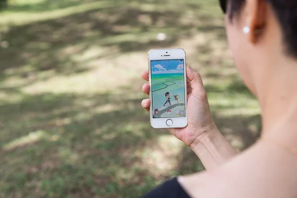KUALA LUMPUR, MALAYSIA, JULY 24, 2016: An IOS user plays Pokemon