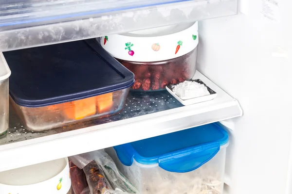 Baking soda placed in refrigerator to deodorize bad odor.