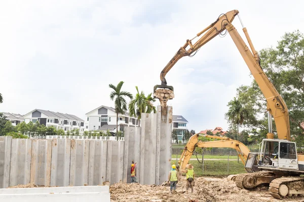 Crane lifted and placed concrete bars into position.