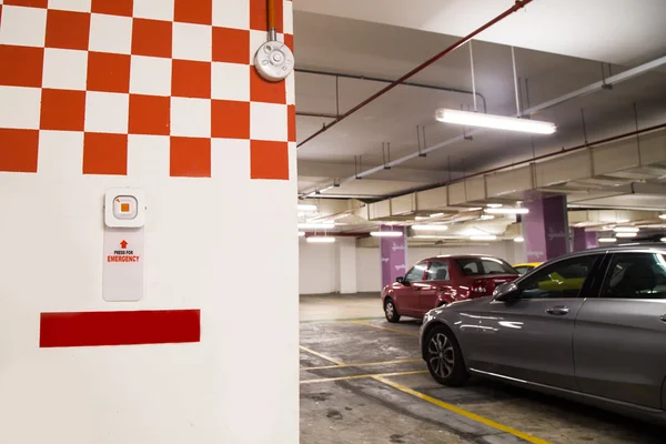 Emergency alarm panic button at car park complex for security