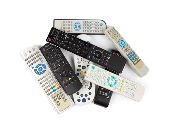 Stack of audio video remote control device in white background