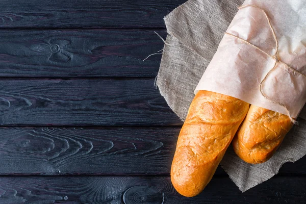 Bread in a paper bag on a napkin