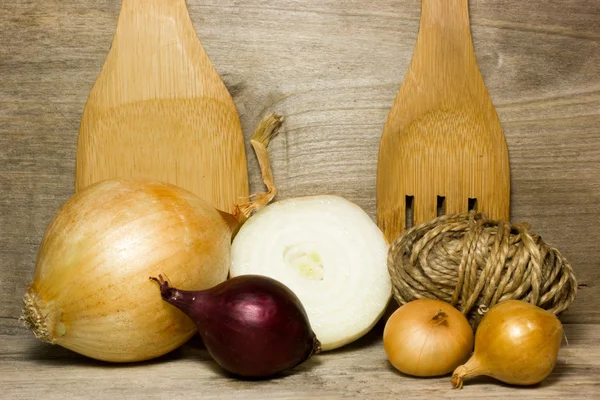 Onion on wooden background in the kitchen