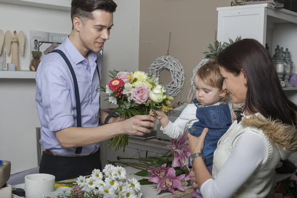 Flower seller with mother and child