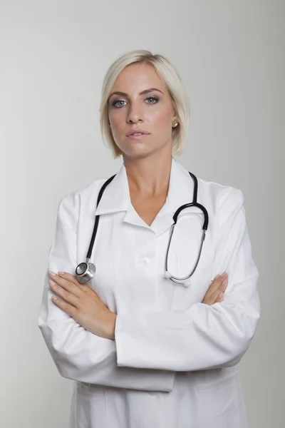 Doctor with crossed arms and stethoscope