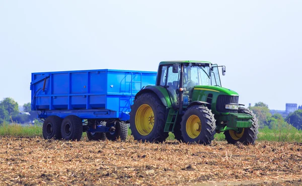 The tractor-trailer on the field