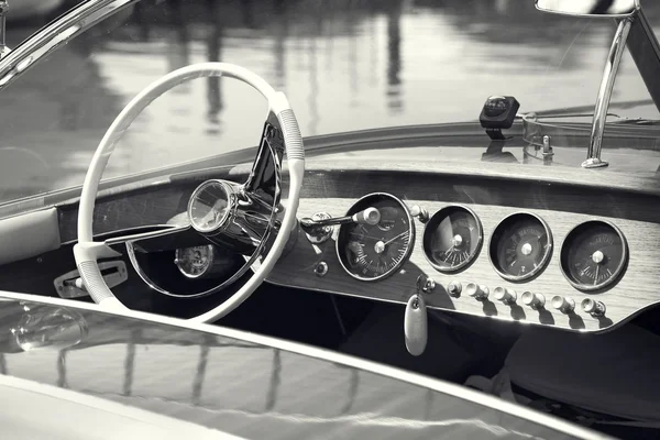 Vintage luxury boat commands