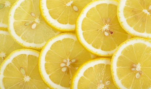 Close up sliced yellow lemon background texture