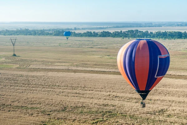Hot air balloon landing to the field