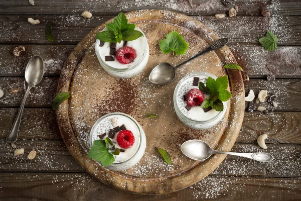 Chia seed pudding with raspberries chocolate and mint Healthy vegan chia pudding