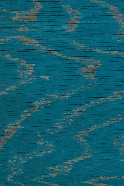 Old painted blue wall. weathered peeling wall