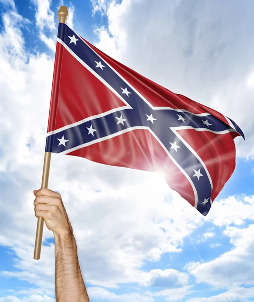 Person\'s hand holding the Confederate States flag and waving it in the sky, part 3D rendering