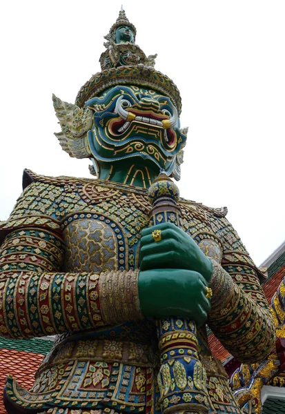 Giant yaksha demon guardian statue at the historic Grand Palace in Bangkok, Thailand