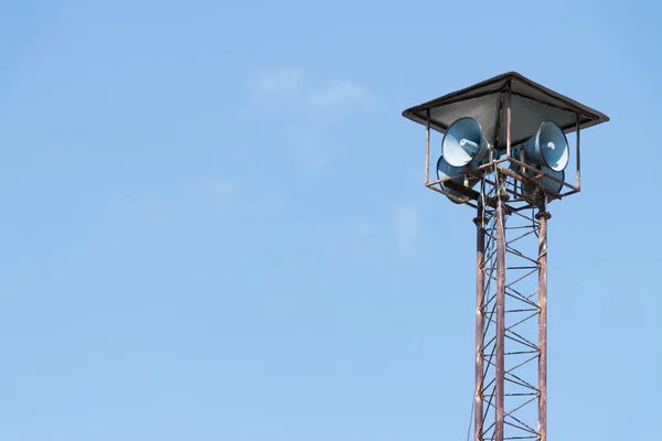 Speaker tower on blue sky