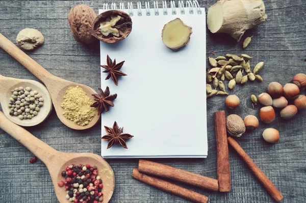 Seasonings,spices,recipe book,Notepad,write,pepper, peas,red pepper,black pepper,cardamom,star anise,cinnamon,coriander,cinnamon sticks,cloves,star