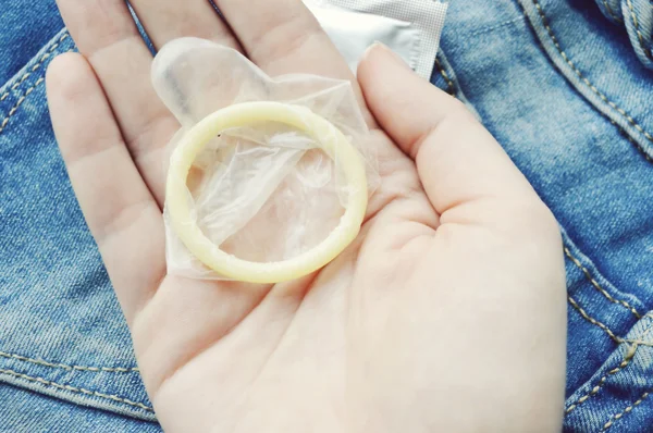 Female holding condom