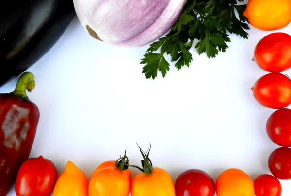 Vegetables, healthy food, small red and yellow tomatoes, red pepper, chili, eggplant on a wooden background