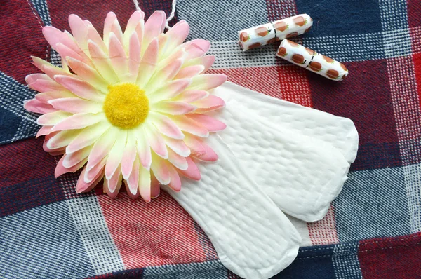 Cotton tampons, orange Gerber and sanitary pads