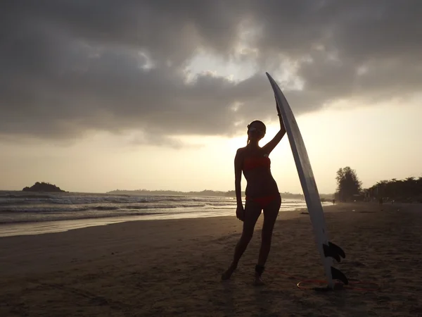 Woman surfing at Goofy surf camp