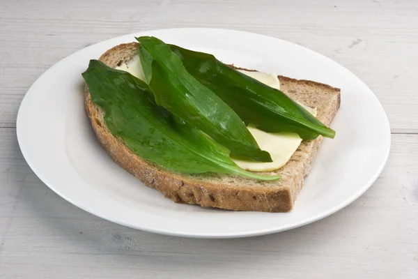 Wild garlic leaves (bear's garlic) on sourdough bread
