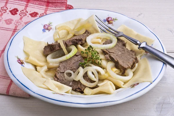 Slow cooked horse meat with homemade noodles, Kazakh dish called Beshbarmak