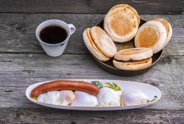 Poached eggs and sausage breakfast