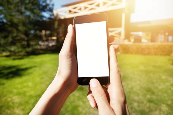 Woman holding mobile phone