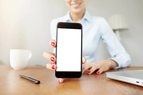 Female office worker showing cell phone