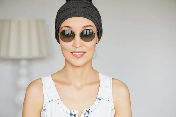 Student girl wearing round sunglasses