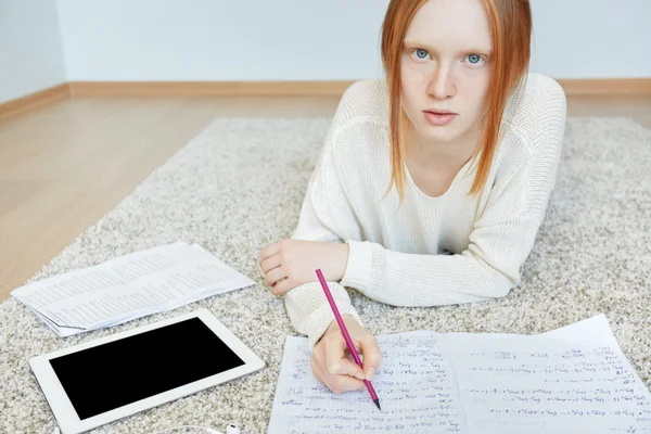 Female teenager doing homework