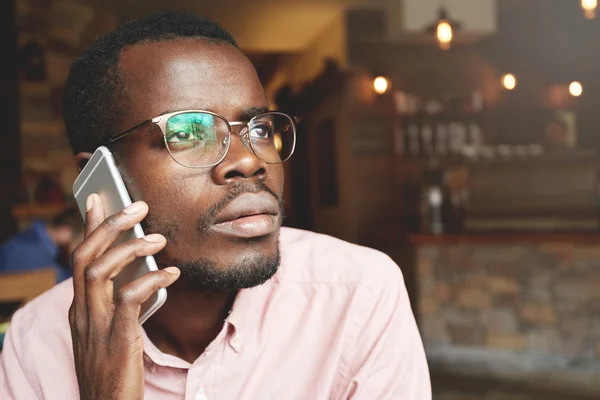 African corporate worker on phone