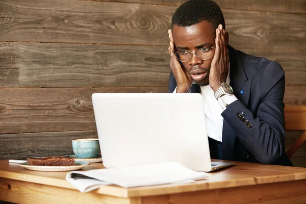 African worker using laptop